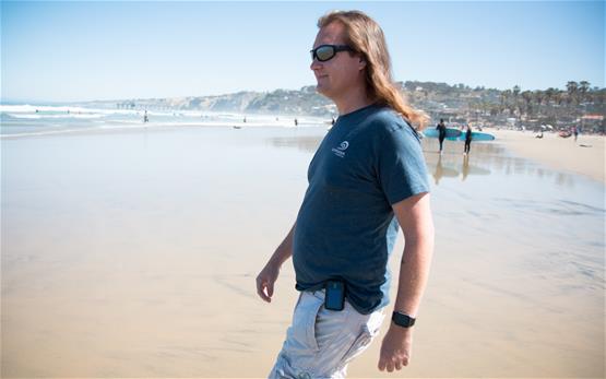 Christopher Wilson walking near a beach