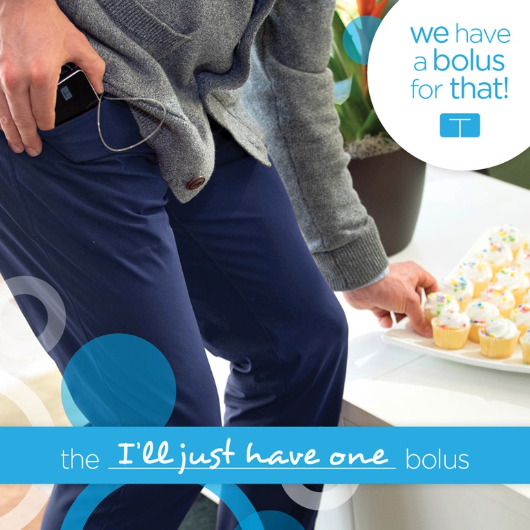 Person in navy denim taking cupcake from a table while holding the t:slim x2 insulin pump in denim pocket. Text Graphics:the I'll just have one bolus; We have a bolus for that!