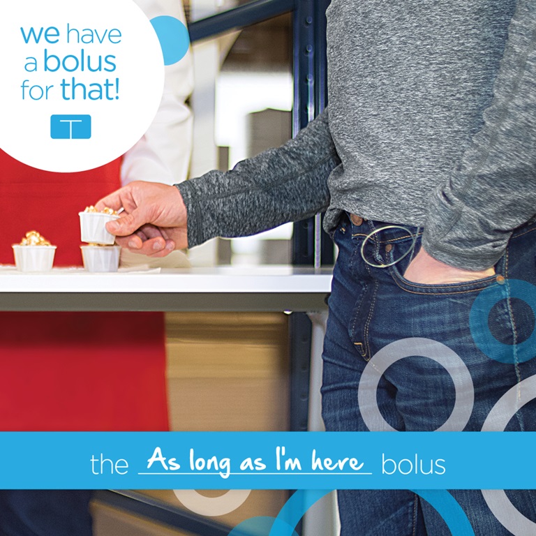 Person in blue denim with hand in pocket and other hand holding a white little cup with snack. Text Graphics: the as long as I'm here bolus; We have a bolus for that!