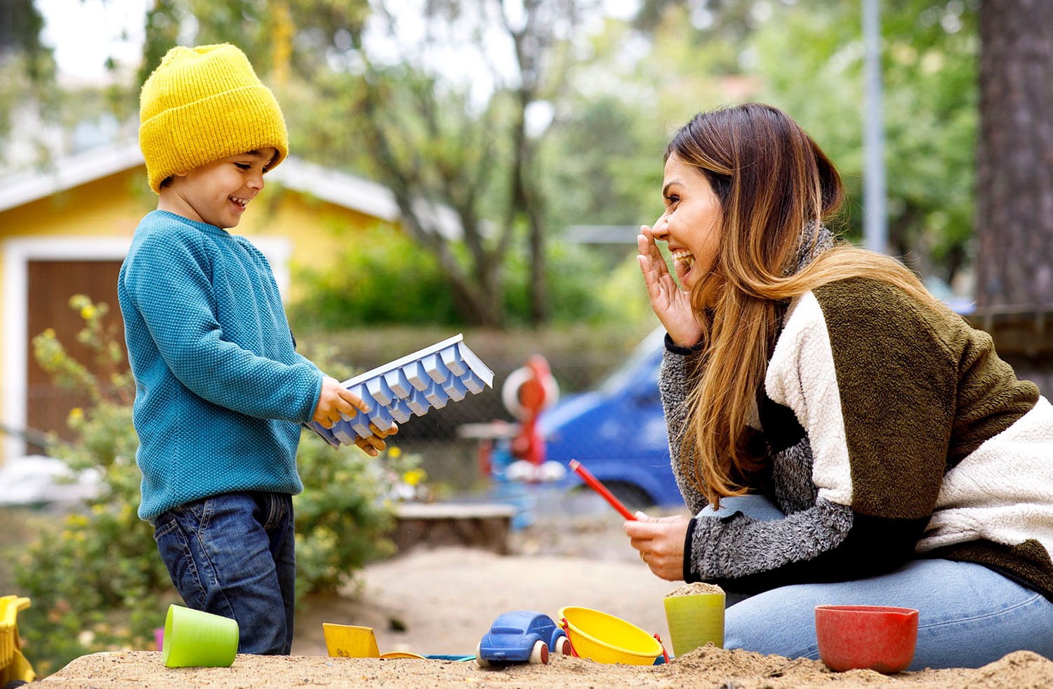 Babysitter and child outdoors