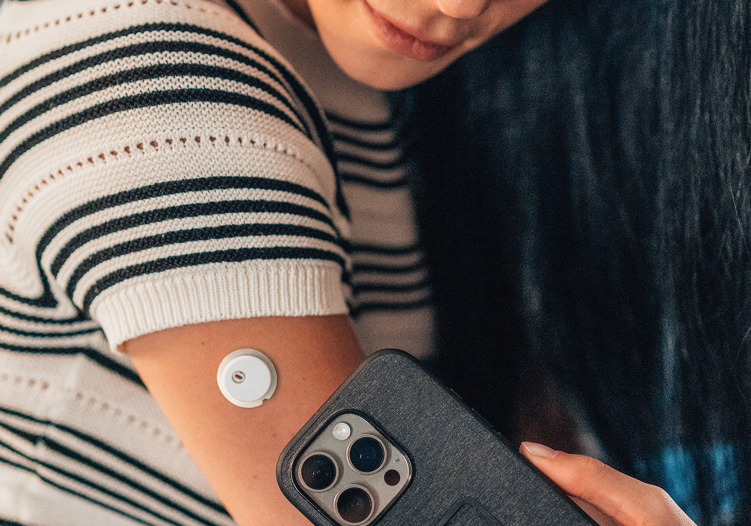 User scanning their FreeStyle Libre 3 Plus Sensor on their Arm