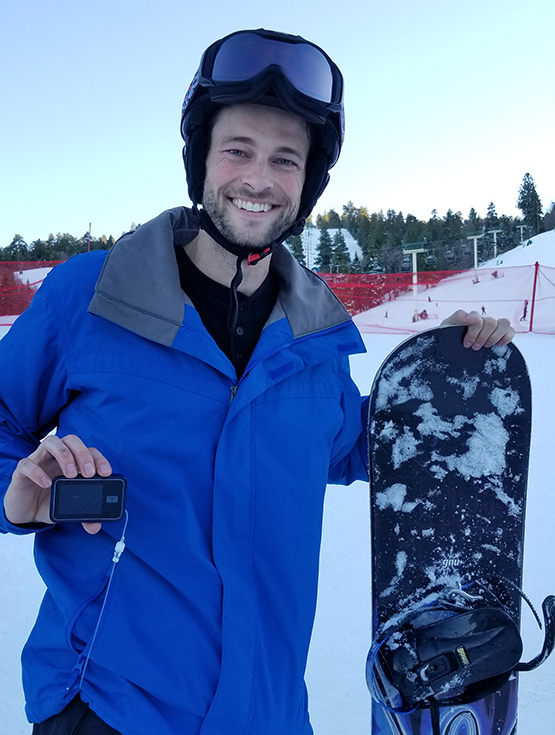 Matt Vande Vegte showing his insulin pump and his snowboard
