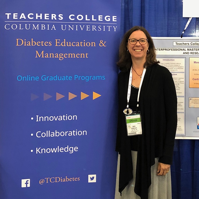 Jane K. Dickinson standing in front of  TCdiabetes banner.