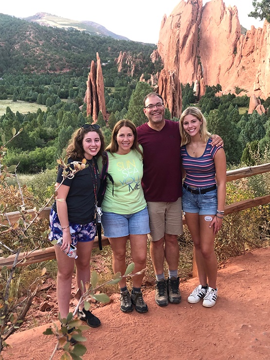 The Oser family near a trail.