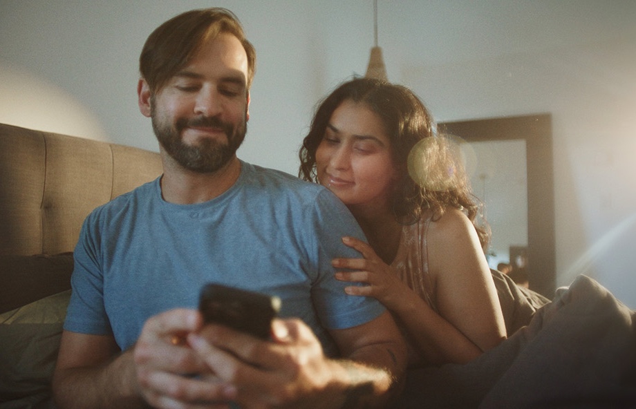 A couple looking at a smartphone
